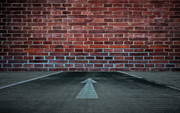 Cisco Prime Collaboration replacement - Cisco Hosted Collaboration Solution reaches end of life - image of hitting a dead end, brick wall