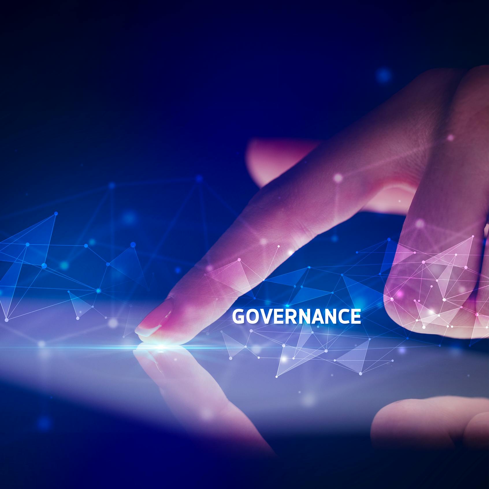 From monitoring to mastery: Why governance is the missing link in digital workplace management - Hand pointing at digital network with the words Governance highlighted