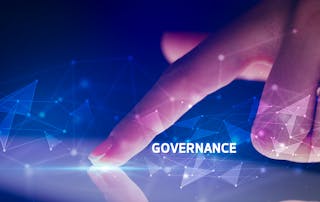 From monitoring to mastery: Why governance is the missing link in digital workplace management - Hand pointing at digital network with the words Governance highlighted