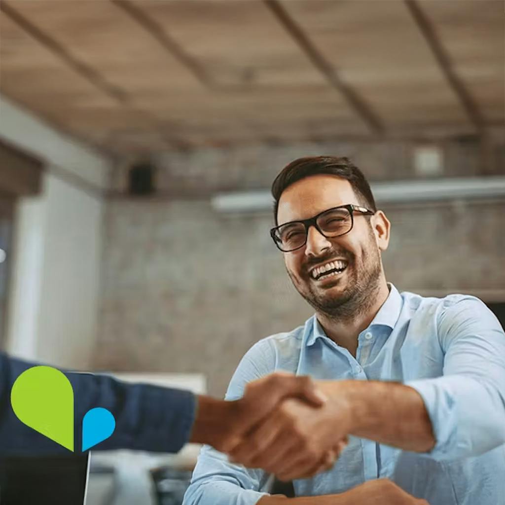 Working with VOSS is different - photo of a very happy man shaking hands