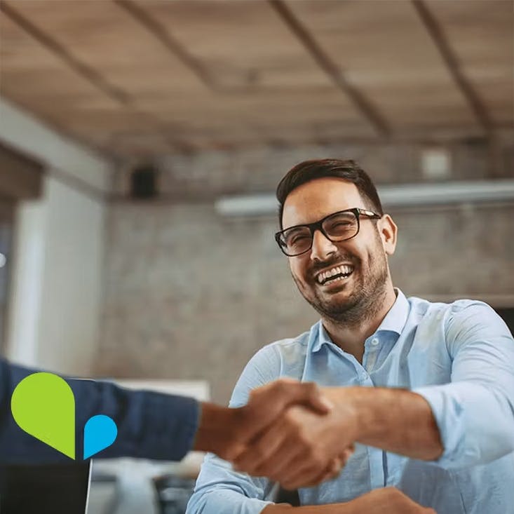 Working with VOSS is different - photo of a very happy man shaking hands