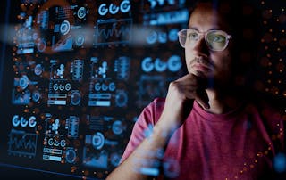 Dark background of Analyst looking at graphical data - used in VOSS blog for Maximizing Business Value with AI in UC: Cost Efficiency and New Opportunities