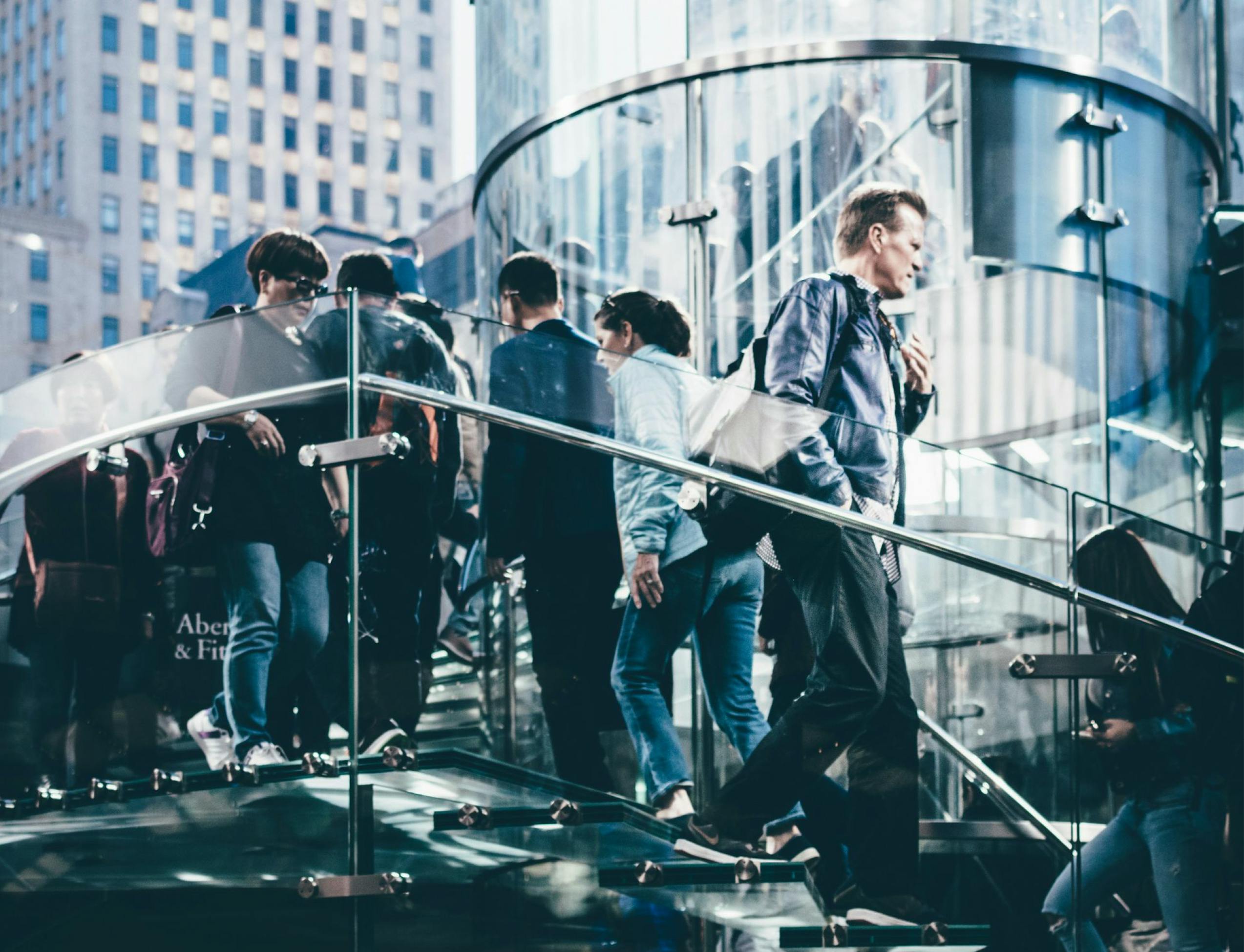 People commuting on stairway - Digital Workplace Management for Professional Services solution sheet cover image