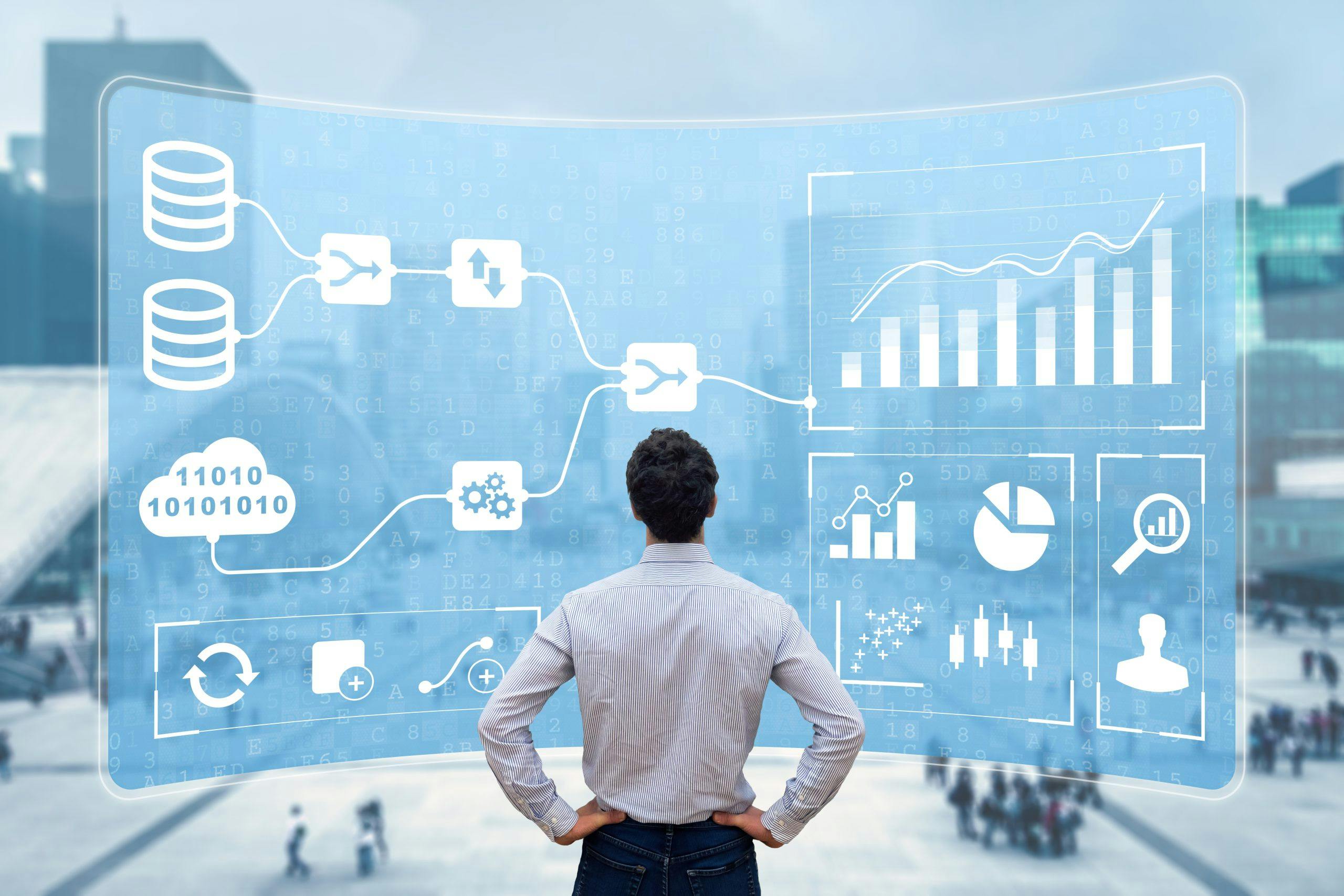 Image of man in front of statistics for Business drivers for UC automation and performance management blog