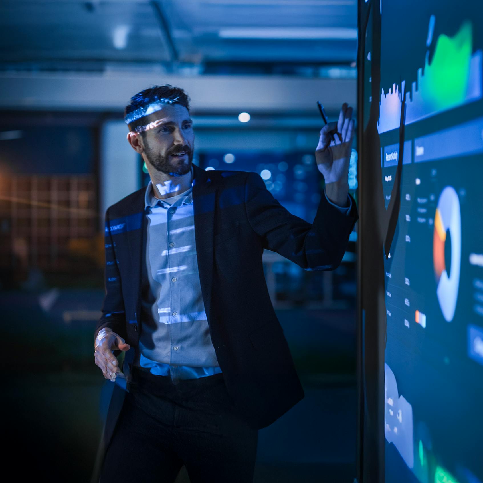 Conference Business Meeting Presentation: CEO Businessman Shows Data to Group of Investors. Used in 'Stop Accepting the Status Quo in Your Digital Workplace' blog