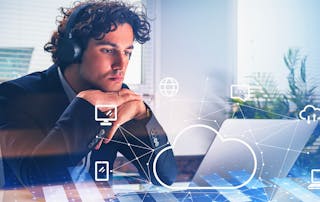 Businessman wearing formal suit is having video conference call via laptop and headphones. Office workplace in the background. Digital interface with cloud data storage. Concept of unified communication.