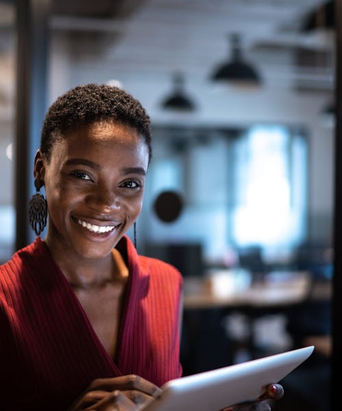 Portrait of businesswoman using digital tablet at office