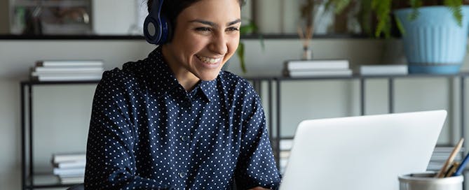 unified communications management made simple with VOSS - happy employee on video meeting