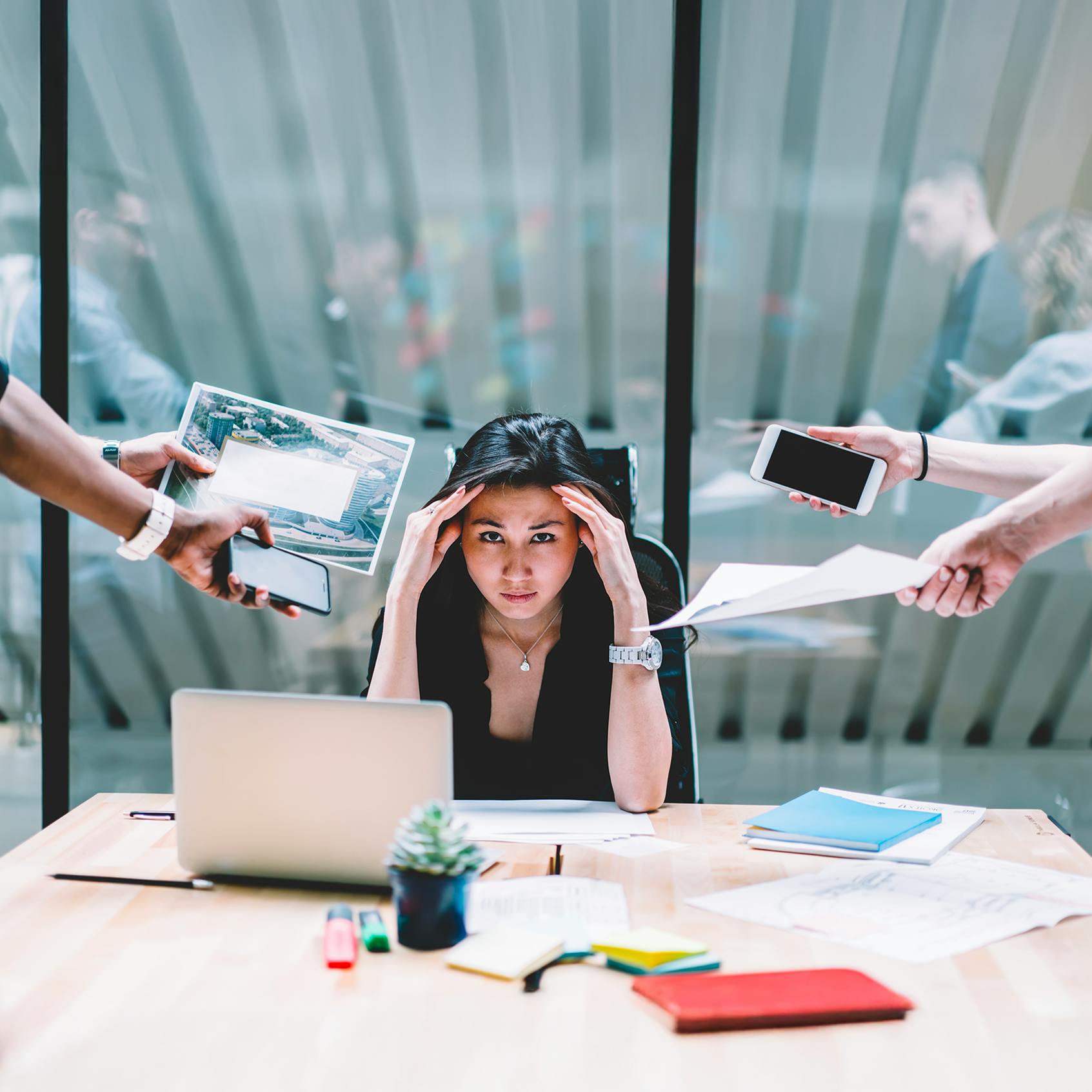VOSS blog - Beyond visibility: Why UC monitoring alone isn’t enough in 2025 - image of business woman with too many tasks