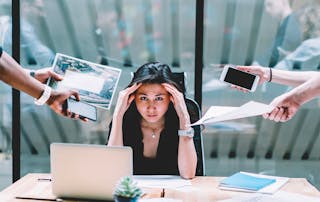 VOSS blog - Beyond visibility: Why UC monitoring alone isn’t enough in 2025 - image of business woman with too many tasks